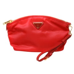 Prada small red clutch with gold hardware and red leather strap