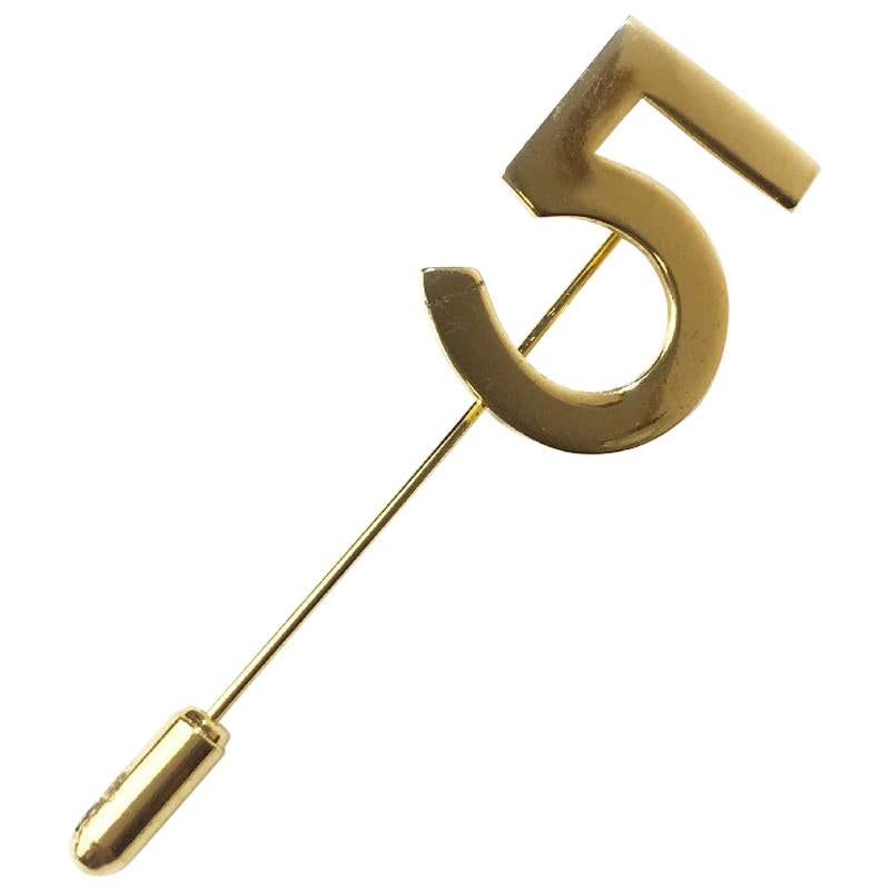 CHANEL Number 5 Pin in Gilt Metal