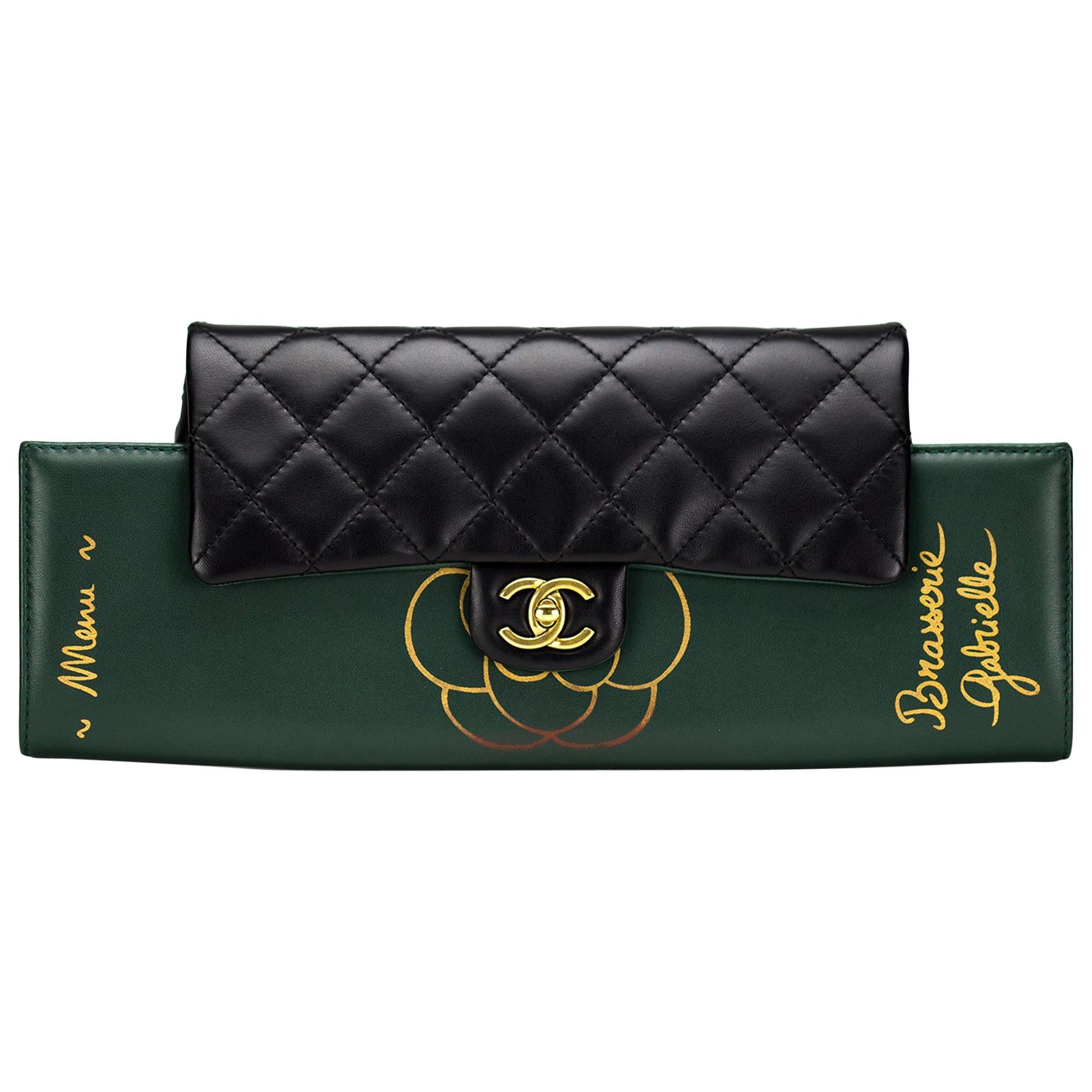 Green calfskin and quilted diamond stitch Chanel Menu clutch flap

Year: 2015
Gold hardware
Classic interlocking cc clasp
Interior large pocket
Two additional interior pockets
Interwoven chain
Can be carried as a flap or clutch
6.5” H x 15” W x 2”