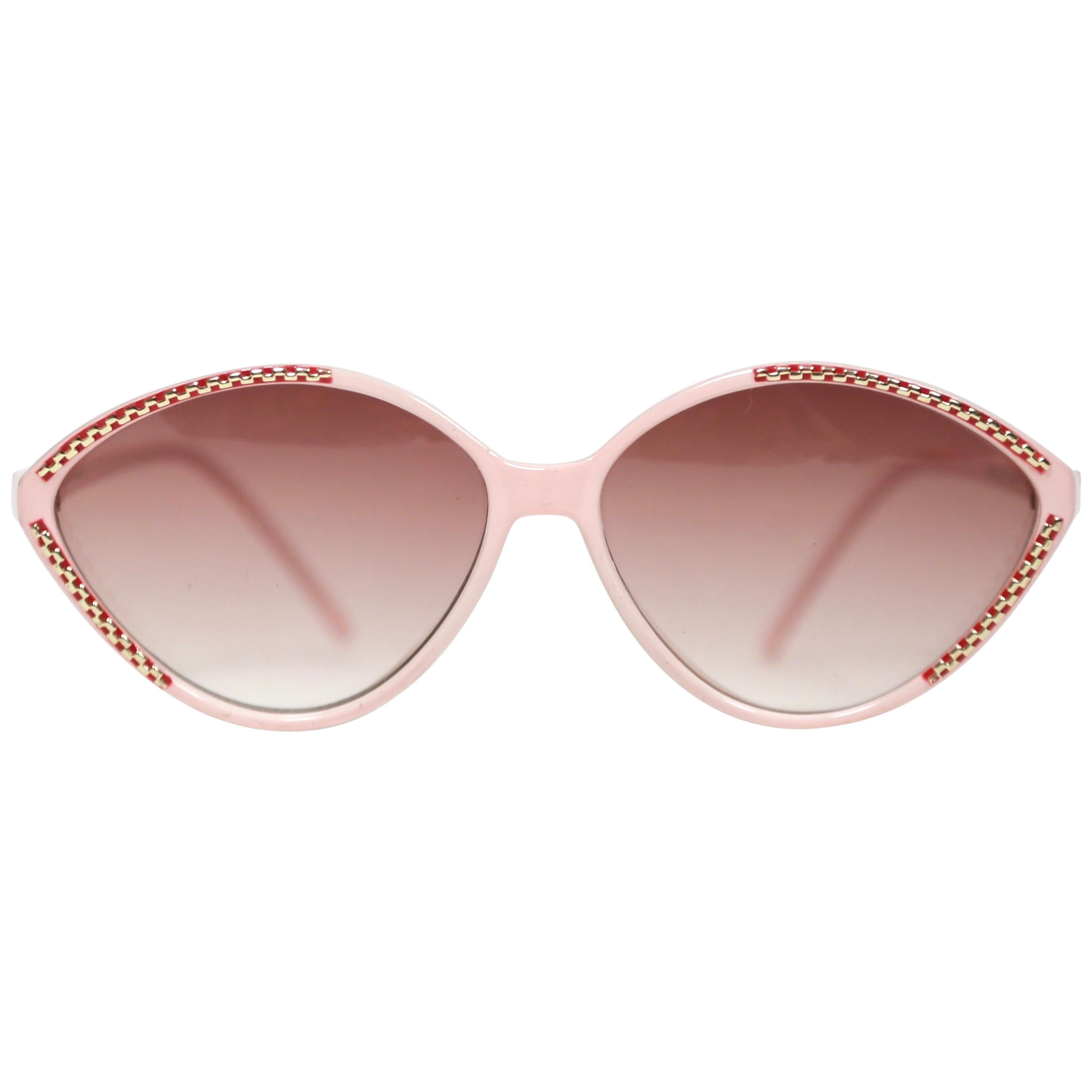 Balenciaga pink and burgundy plastic sunglasses with gold accents, 1980s