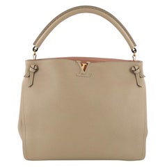 Louis Vuitton Tournon Handbag Leather 