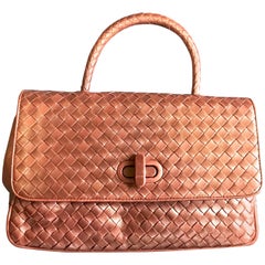 Vintage Bottega Veneta intrecciato bronze lambskin bag with turn lock closure.