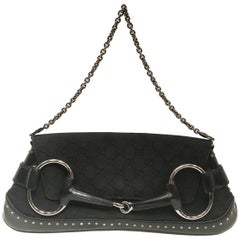 Gucci black canvas monogram horsebit clutch bag