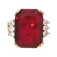 Faux emerald cut ruby & diamond ring set in gold