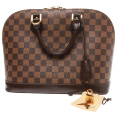 Louis Vuitton Alma PM Handbag with key clochette