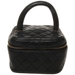 Chanel black quilted makeup case