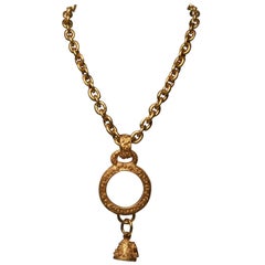 Chanel chain with magnifying glass and bell dangle pendant