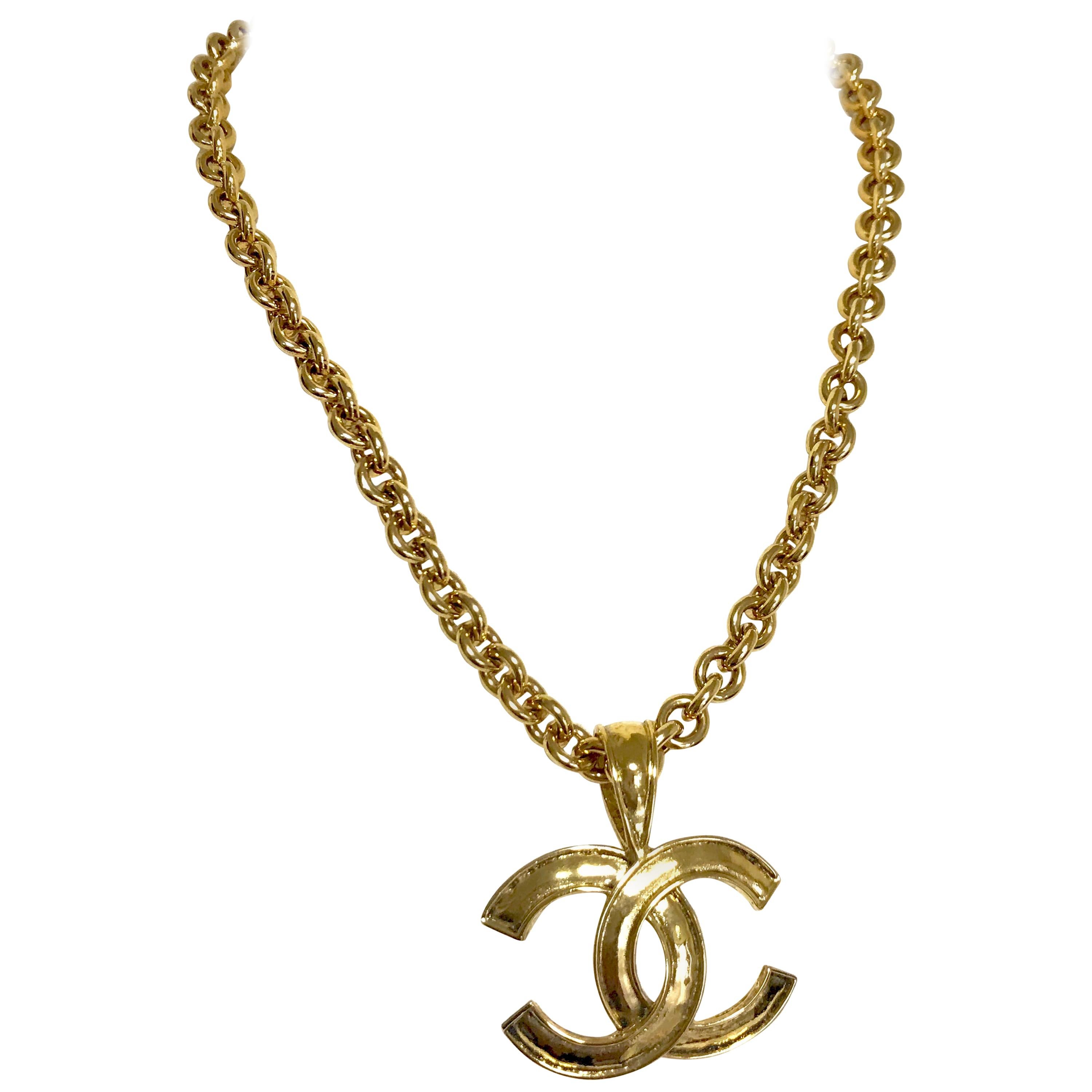 Vintage CHANEL golden chain necklace with large CC mark logo pendant top.  For Sale