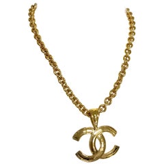 Vintage CHANEL golden chain necklace with large CC mark logo pendant top. 