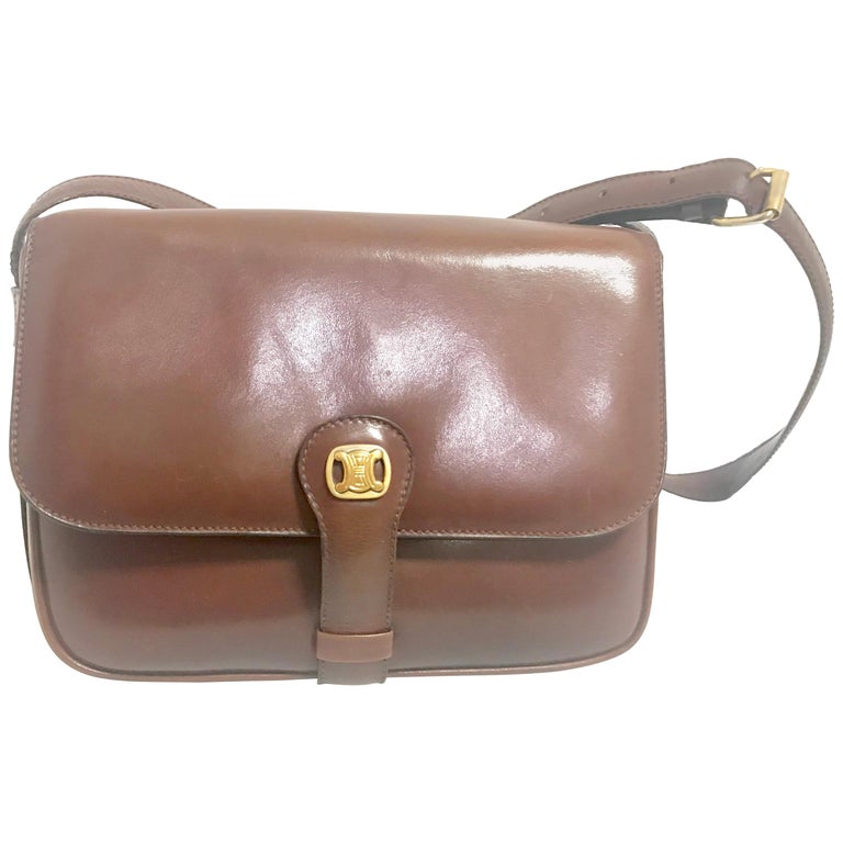 Celine Vintage genuine brown leather shoulder bag with golden logo motif  For Sale