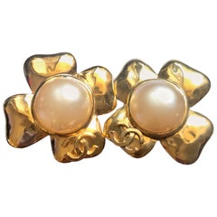 Chanel Vintage large golden camellia flower earrings with faux pearl and CC mark