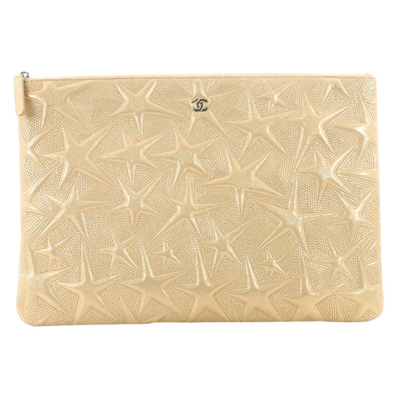 Chanel O Case Clutch Star Embossed Lambskin Large 