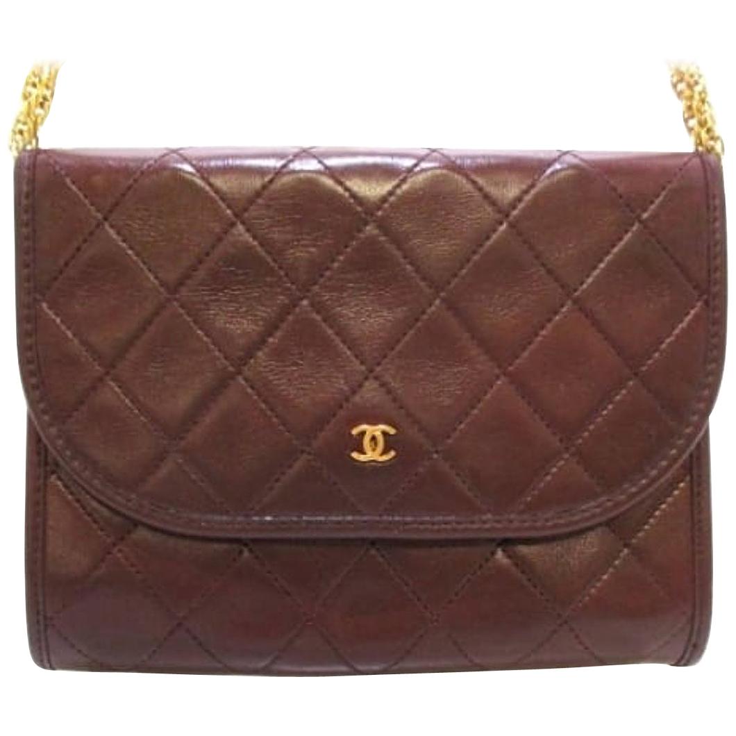 Vintage CHANEL brown 2.55 style mini shoulder bag with CC and skinny chains. For Sale