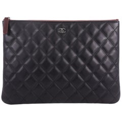 Chanel O Case Clutch Quilted Lambskin Medium 