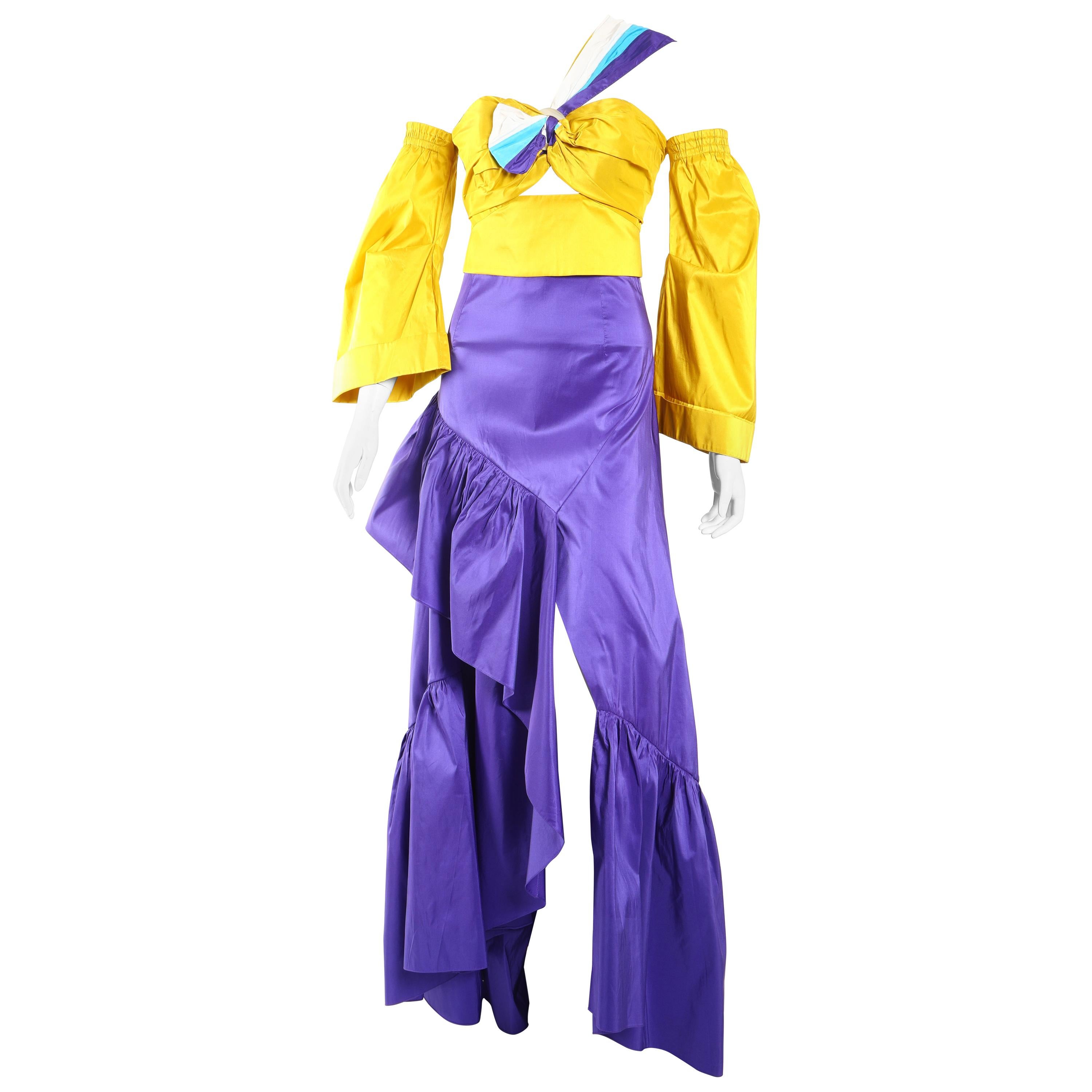 Peter Pilotto Yellow Taffeta Crop Top with Purple Ballroom Skirt 

This Peter Pilotto paneled, yellow, taffeta Top with  purple long Skirt is a show-stopper! 
Sleeve are off the shoulder and skirt sits on the waist.

Never worn or no signs of wear.