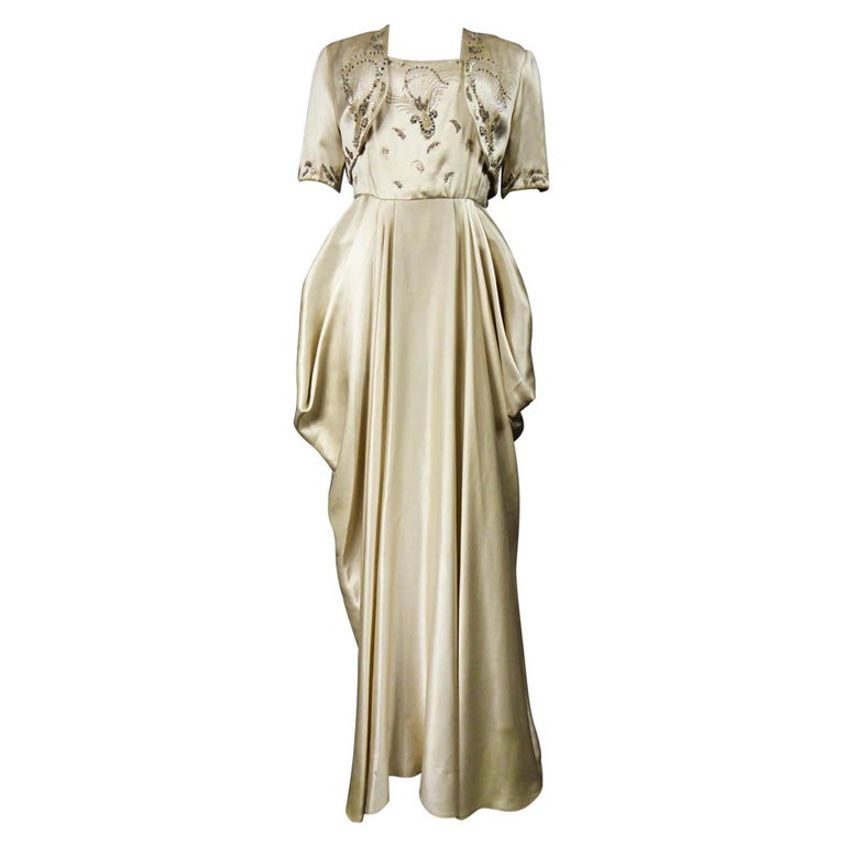 A Pierre Balmain Ceremonial Satin Evening Dress Bolero and Purse Circa 1950  For Sale at 1stDibs | balmain evening dresses, pierre balmain 1950, pierre balmain  evening dress in pale pink satin and