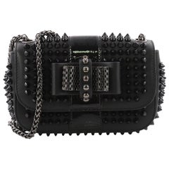 $1,395, Christian Louboutin Sweet Charity Small Spiked Crossbody