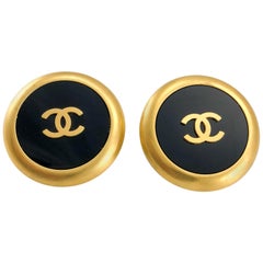 1992 Chanel Large Black And Golden Round Logo Earrings
