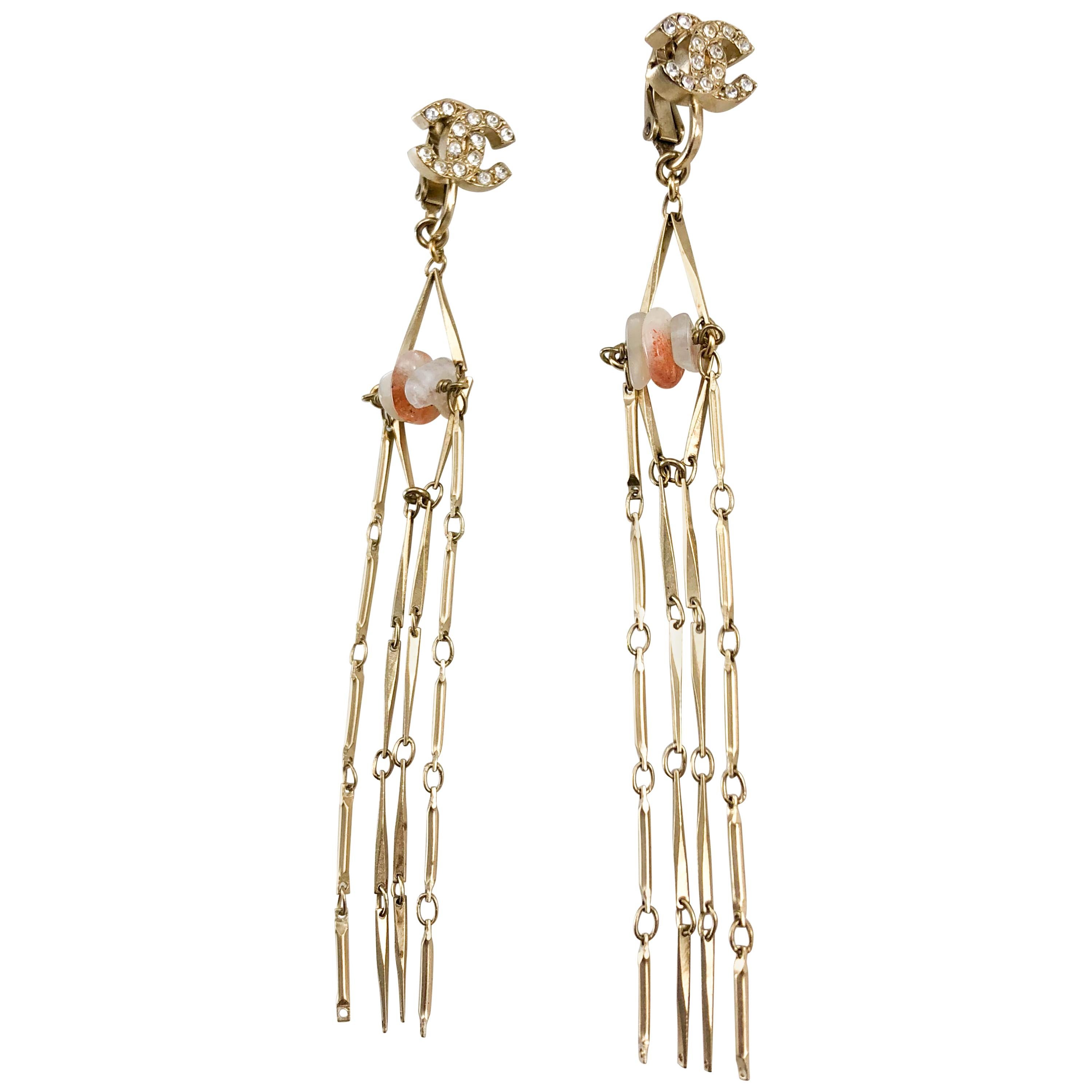 2011 Chanel Long Gilt Dangling Logo Earrings With Agate Pebbles For Sale