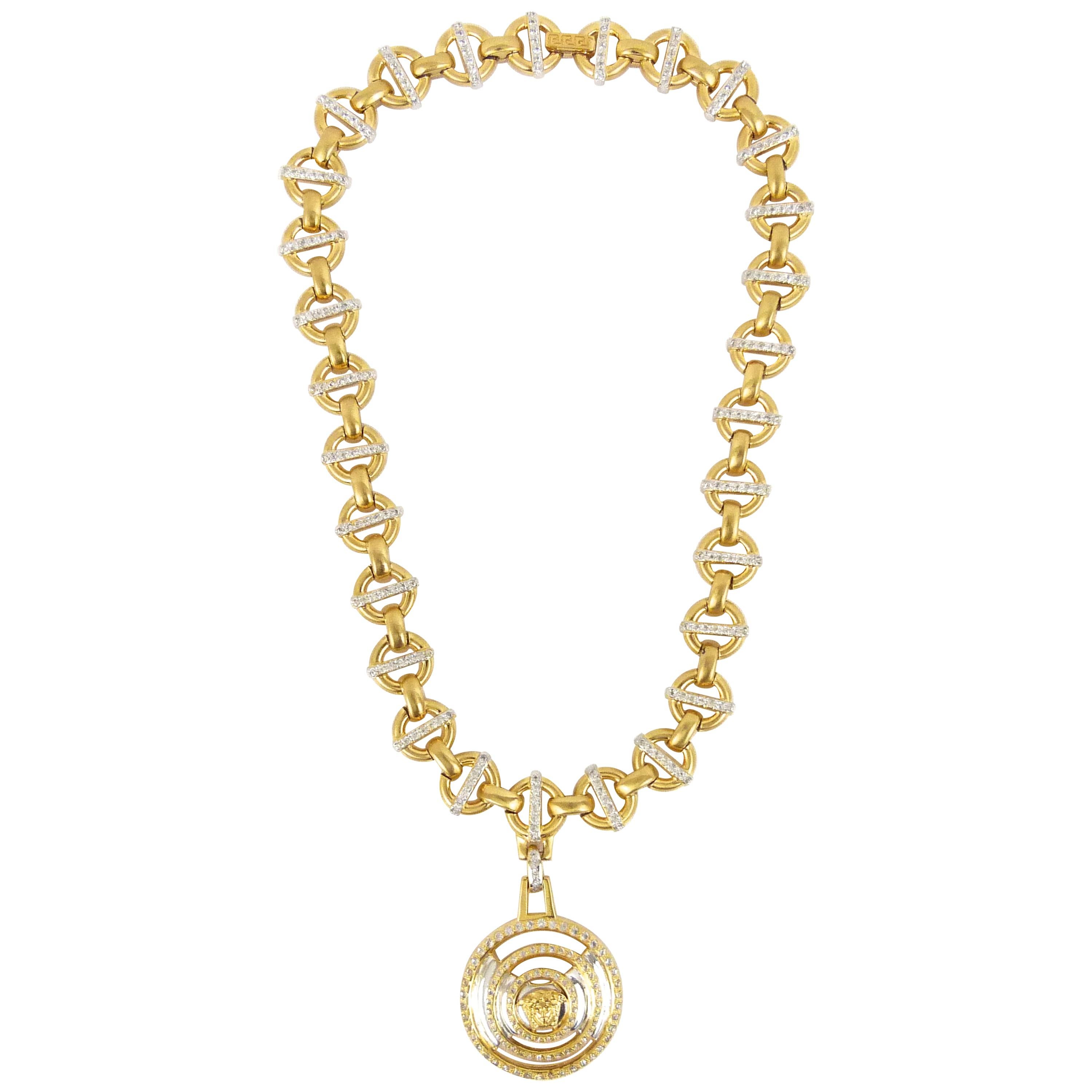 Gianni Versace 1990s gold circular necklace with medusa head pendant 