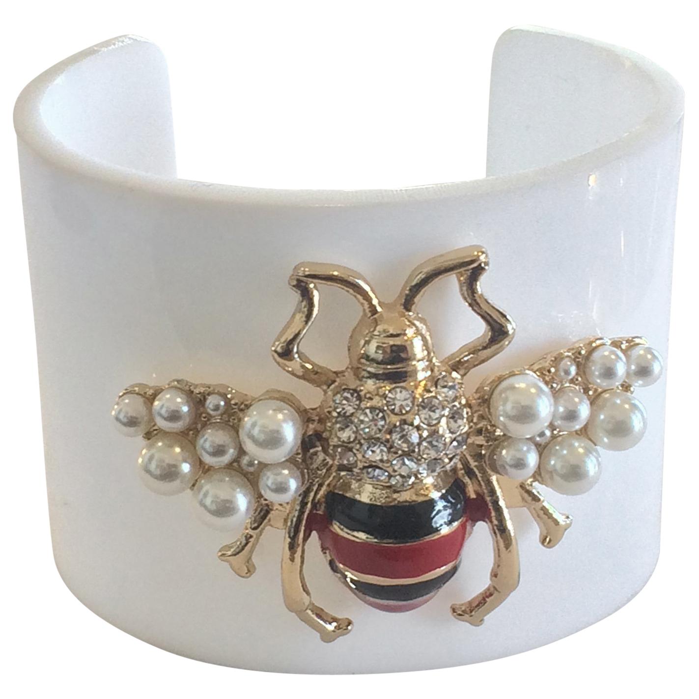 Oscar De La Renta Lucite cuff bracelet with Bumble Bee