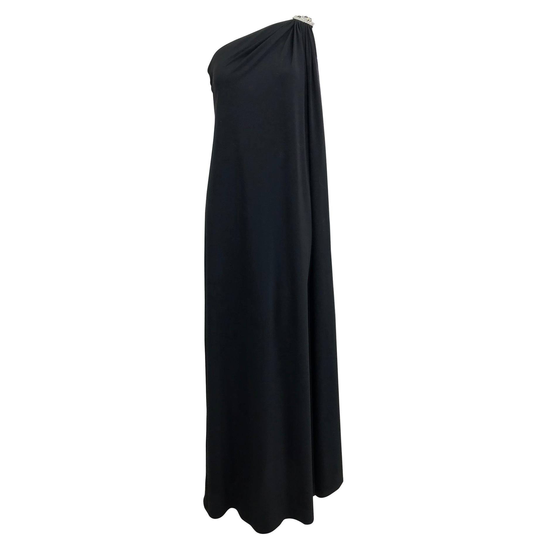 Adele Simpson black jersey one shoulder gown with jewel clasp