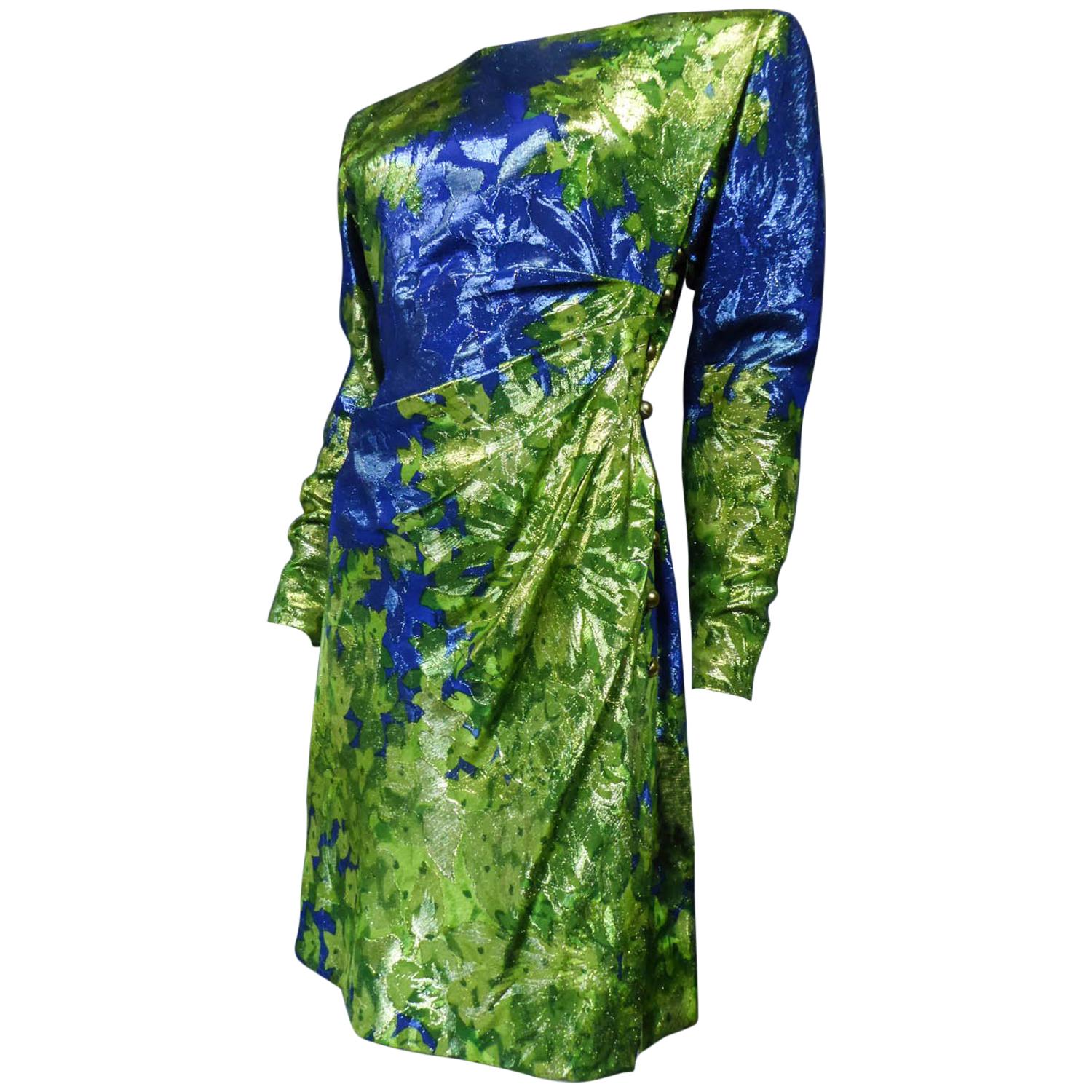 Circa 1989
France

Cocktail dress in green and blue lamé printed with floral impressionist inspired patterns from the Van Gogh Collection by the famous couturier. Delicate graphical overlay from yellow, gold to soft green and electric blue inspired
