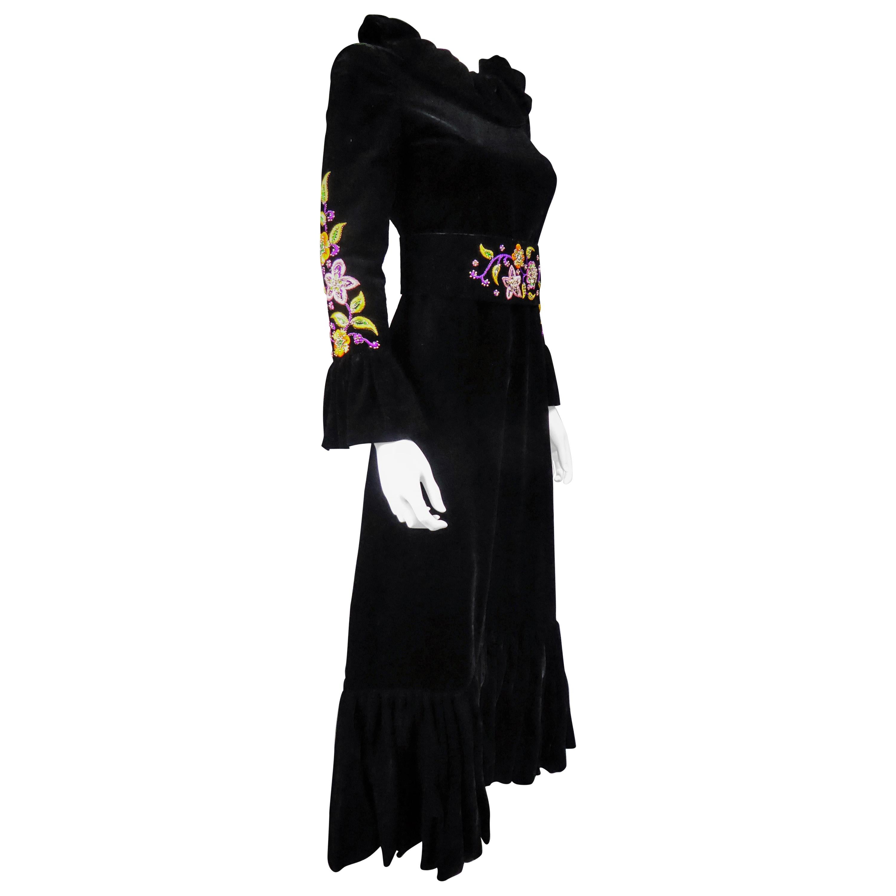 Circa 1990
France

Long evening dress in black silk velvet by Jean-Louis Scherrer Haute Couture dating from the 1990s. Pleated collar in bouillonné velvet ruff found on the sleeves and the bottom of the dress which is flared. Psyquedelic embroidery