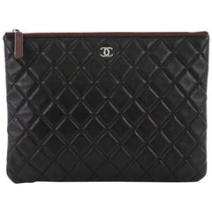 Chanel O Case Clutch Quilted Lambskin Medium