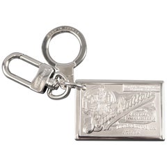 Vintage LOUIS VUITTON Silver Tone Metal Travelling Requisites Paris Embossed Key Ring