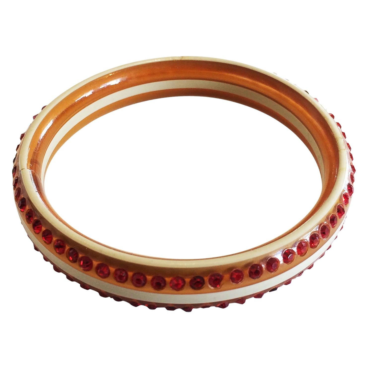 Art Deco red and cream celluloid bangle bracelet with rhinestones
