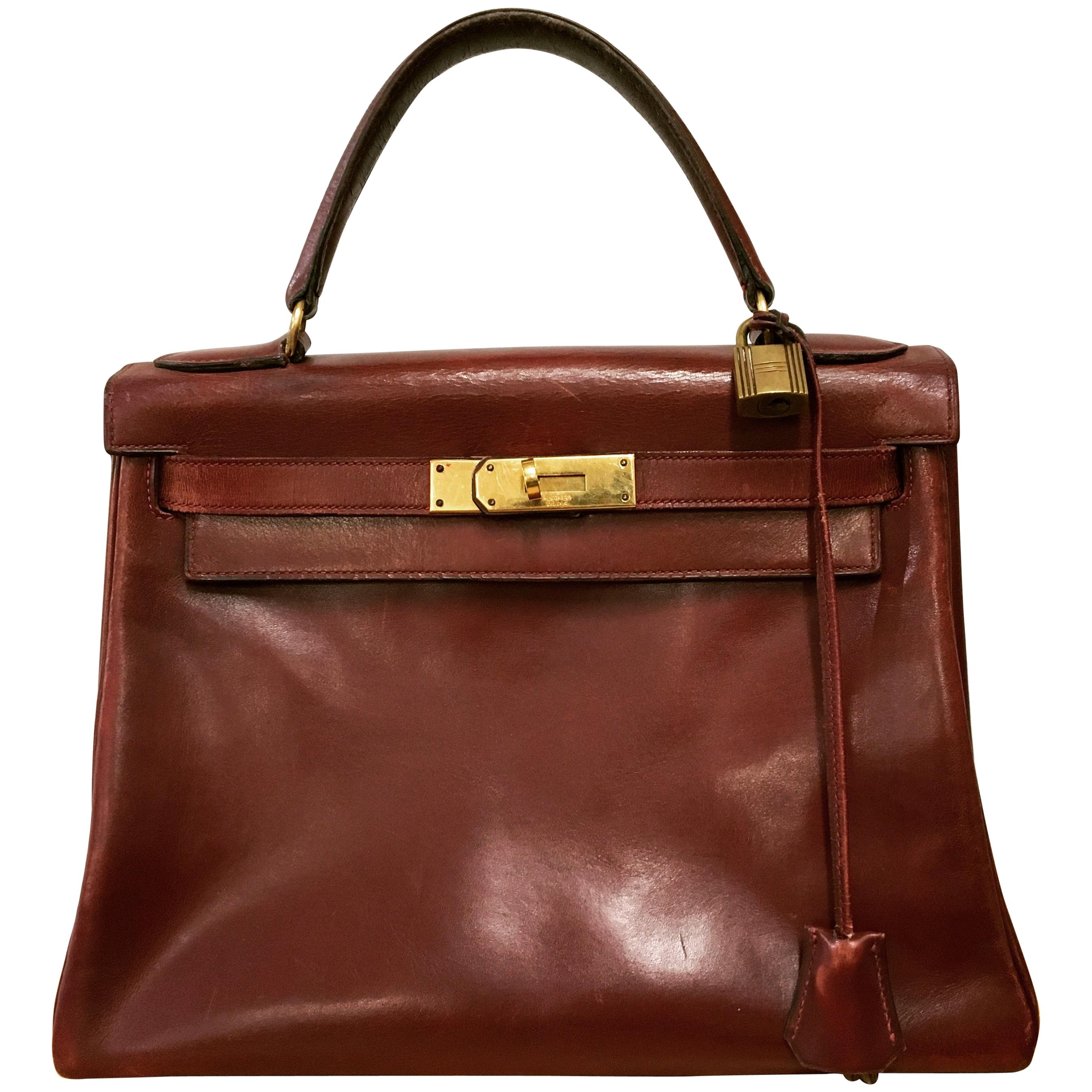  Hermès vintage 1950's marron/ burgundy leather Kelly bag.