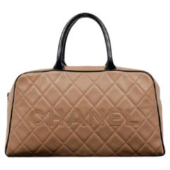 Chanel Two-tone Quilted Caviar Cc Duffle 216664 Beige X Black Leather Satchel