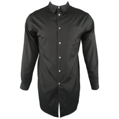 COMME des GARCONS HOMME PLUS T-shirt comes in black cotton jersey with a crewnec