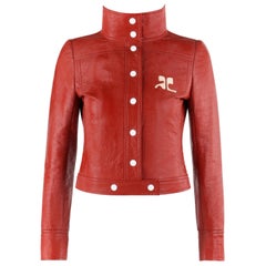 COURRÈGES - Veste courte avec logo en faux cuir et vinyle rouge brique, signature modulaire, circa 1970