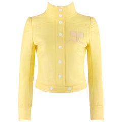 Veste courte Courrèges en vinyle jaune caractéristique Icterine avec logo, circa années 1970