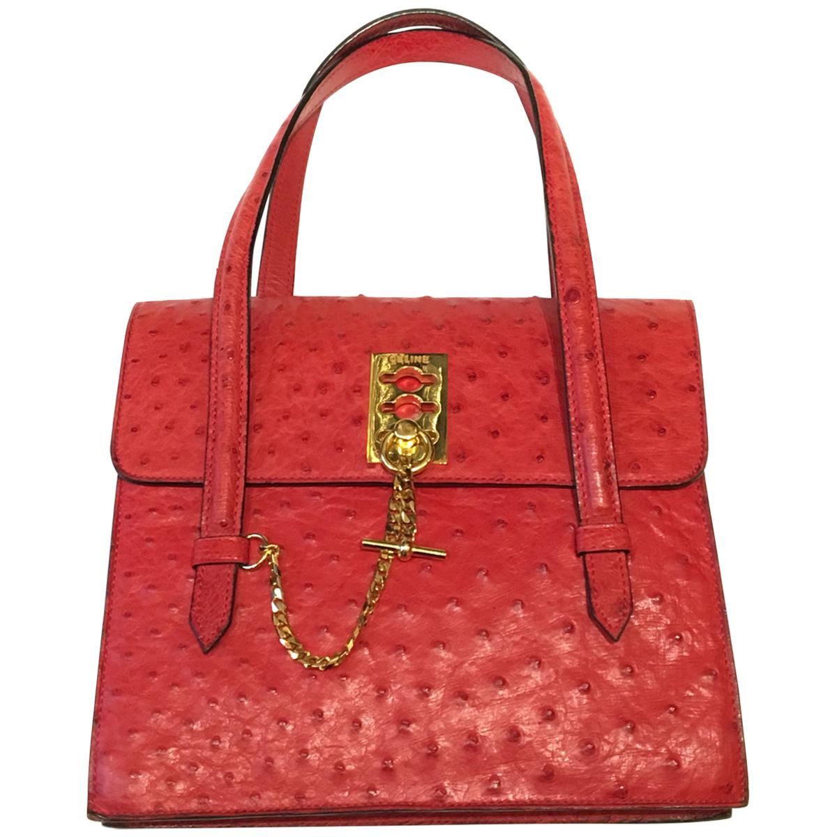Vintage Celine Red Ostrich bag with golden hardware.