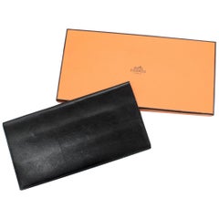 Hermes black leather bi-fold travel wallet