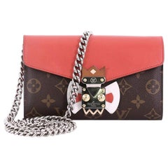 LOUIS VUITTON Monogram Tribal Mask Chain Wallet Rouge 614548