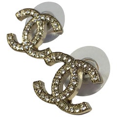 CHANEL CC Stud Earrings in Pale Gilded Metal set with White Rhinestones