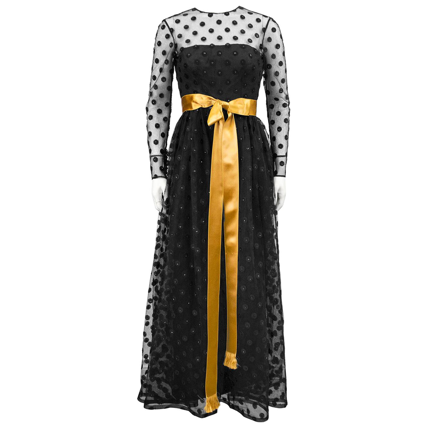 1960s Anonymous Black Long Sleeve Gown with Polka Dot Net Overlay and Gold Sash  For Sale