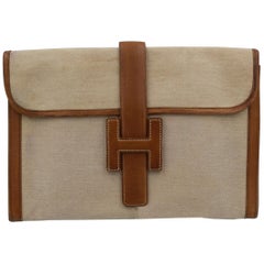 Vintage Hermes Jige MM Clutch in Canvas and Leather.