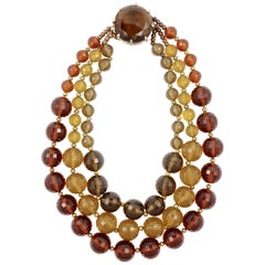 Vintage Gold Plated Triple Strand Multi Colored Plastic Bead Necklace with a Glass Clasp