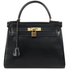 HERMES um 1970 "Kelly Retourne" 28 cm Black Box Kalbsleder Geldbörse mit Griff oben