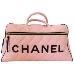 1990s Rare Chanel Black/Pink Quilted Leather Boston Duffle