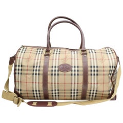 Duffle Boston à carreaux Burberry Nova avec sangle 869091 toile enduite beige Weekend/