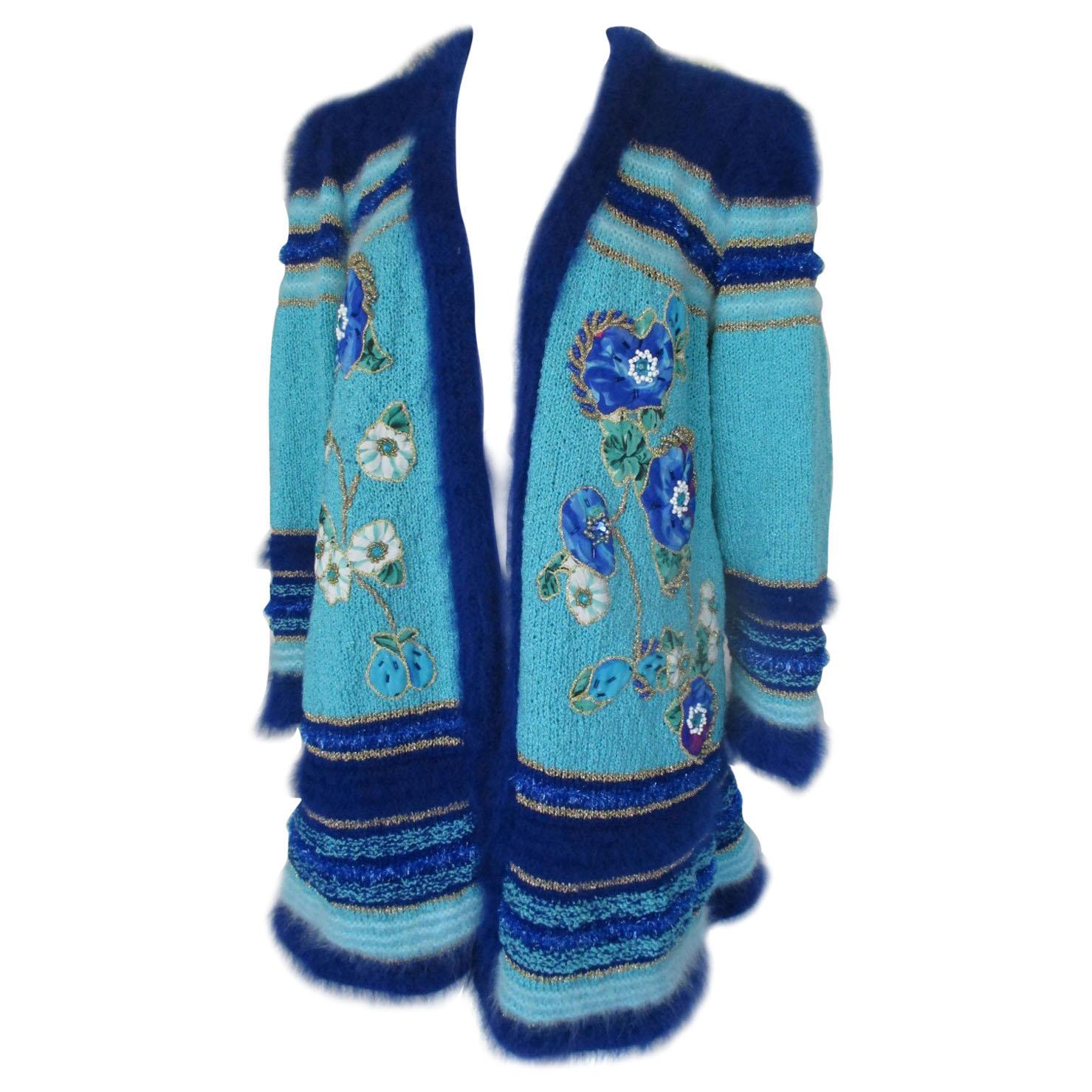 Turquoise coat with flower appliqués