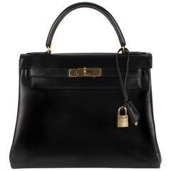 Hermès Kelly 28 in black box calf leather in very good condition!