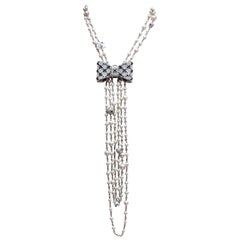 CHANEL 2015 Beautiful chains and pearls necklace with a jewel bow