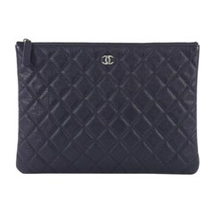 Chanel O Case Clutch Quilted Caviar Medium